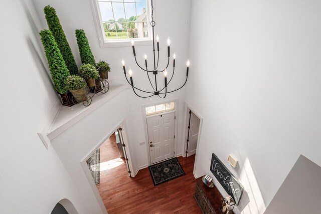 7212 New Albany Links Dr, New Albany, OH 43054 - entrance foyer with a chandelier, dark wood finished floors, and a high ceiling