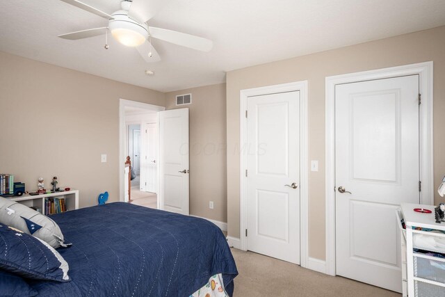 7212 New Albany Links Dr, New Albany, OH 43054 - bedroom with light colored carpet and a ceiling fan