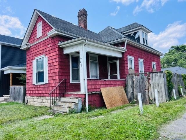 420 Jenkins Ave, Columbus, OH 43207 - view of property exterior with roof with shingles and a chimney