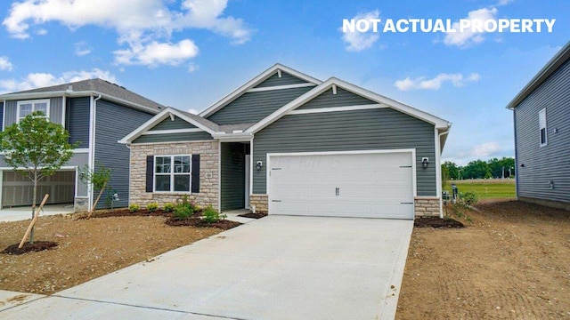 183 Badger Pass, Newark, OH 43055 - craftsman-style home with stone siding, driveway, and an attached garage