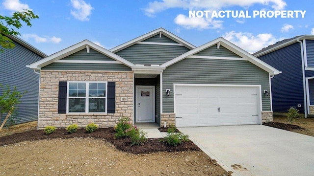 183 Badger Pass, Newark, OH 43055 - craftsman-style home featuring stone siding, concrete driveway, and a garage