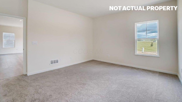 183 Badger Pass, Newark, OH 43055 - carpeted empty room with baseboards