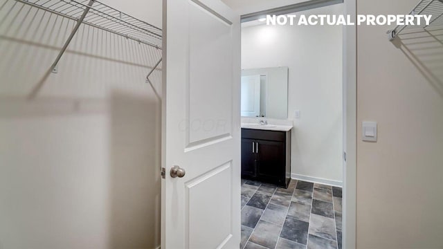 183 Badger Pass, Newark, OH 43055 - spacious closet featuring a sink and stone finish floors