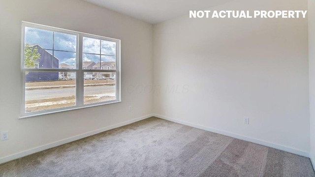 183 Badger Pass, Newark, OH 43055 - carpeted spare room featuring baseboards