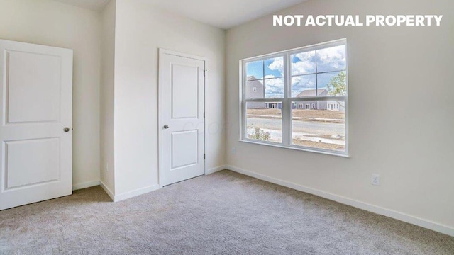 183 Badger Pass, Newark, OH 43055 - unfurnished bedroom with carpet flooring and multiple windows