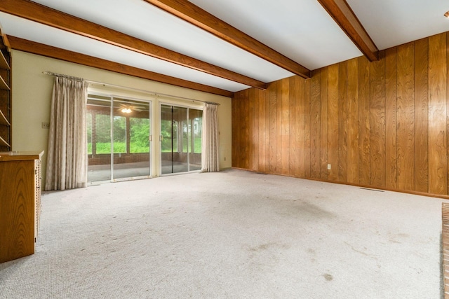 893 Singing Hills Ln, Columbus, OH 43235 - unfurnished room with beam ceiling, carpet flooring, and wood walls