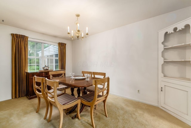 893 Singing Hills Ln, Columbus, OH 43235 - dining space featuring a chandelier and light colored carpet