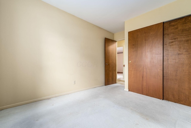 893 Singing Hills Ln, Columbus, OH 43235 - unfurnished bedroom featuring light colored carpet and a closet