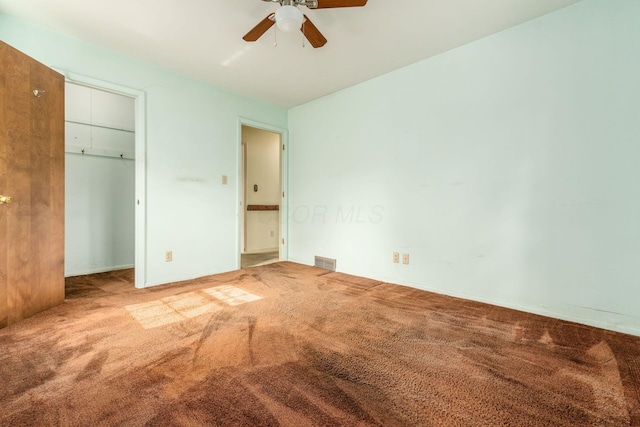 893 Singing Hills Ln, Columbus, OH 43235 - unfurnished bedroom with carpet flooring, a closet, and a ceiling fan