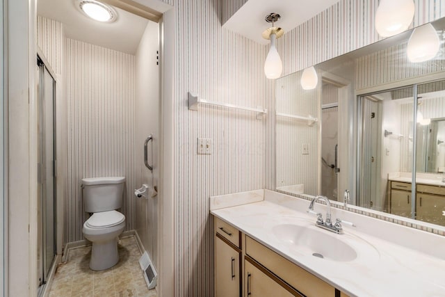 893 Singing Hills Ln, Columbus, OH 43235 - bathroom with wallpapered walls, vanity, and tile patterned floors