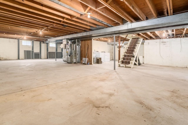 893 Singing Hills Ln, Columbus, OH 43235 - basement featuring washer and clothes dryer, stairs, gas water heater, and heating unit