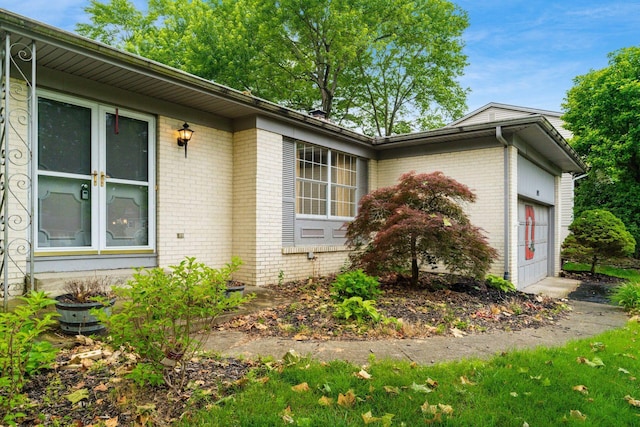 893 Singing Hills Ln, Columbus, OH 43235 - view of home's exterior featuring brick siding and an attached garage
