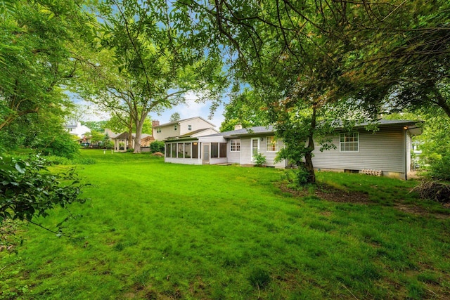 893 Singing Hills Ln, Columbus, OH 43235 - view of green lawn featuring a sunroom