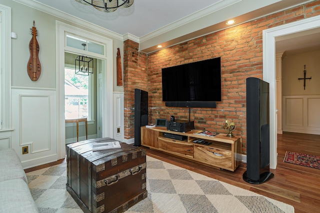 33 E Frankfort St, Columbus, OH 43206 - living room with a decorative wall, wood finished floors, crown molding, and wainscoting