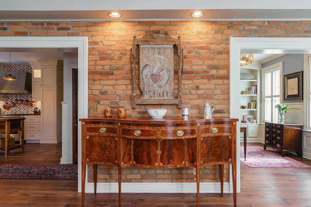 33 E Frankfort St, Columbus, OH 43206 - detailed view of wall chimney exhaust hood, wood finished floors, and backsplash