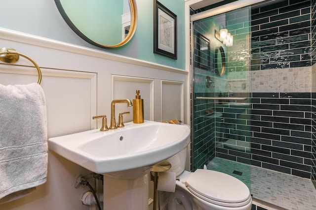 33 E Frankfort St, Columbus, OH 43206 - full bath with a stall shower, a decorative wall, and a wainscoted wall