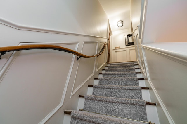 33 E Frankfort St, Columbus, OH 43206 - stairs with a decorative wall and a wainscoted wall
