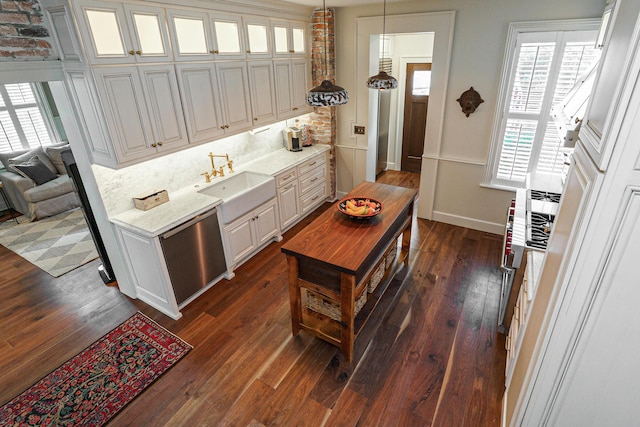 33 E Frankfort St, Columbus, OH 43206 - kitchen with dark wood-type flooring, decorative light fixtures, glass insert cabinets, decorative backsplash, and white cabinetry