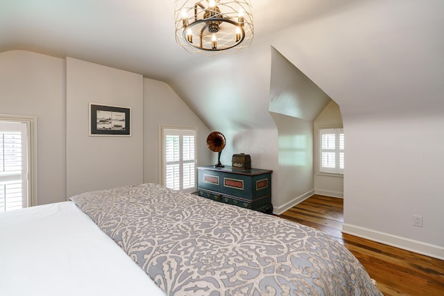 33 E Frankfort St, Columbus, OH 43206 - bedroom featuring lofted ceiling, a chandelier, and wood finished floors