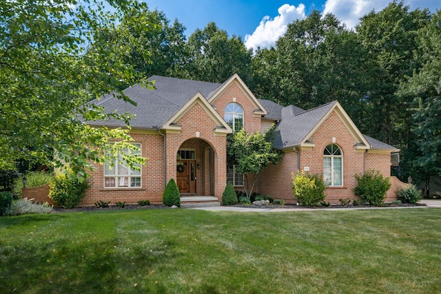 8918 Filiz Ln, Powell, OH 43065 - traditional home with a front lawn and brick siding