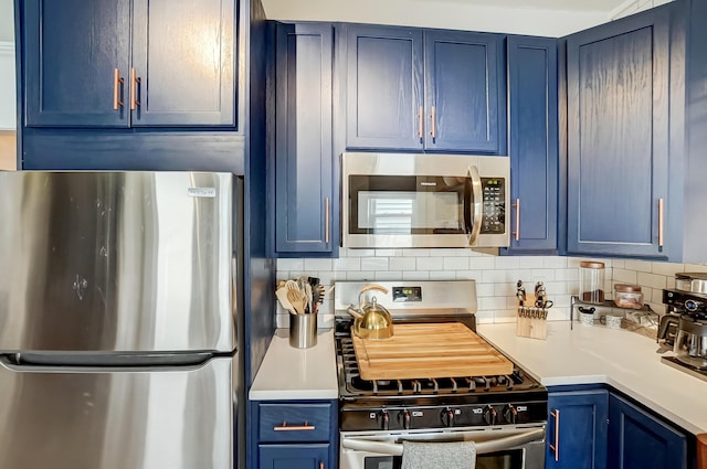 573 E Mithoff St, Columbus, OH 43206 - kitchen featuring stainless steel appliances, blue cabinets, and light countertops