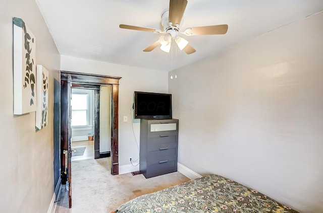 573 E Mithoff St, Columbus, OH 43206 - bedroom featuring light carpet and a ceiling fan