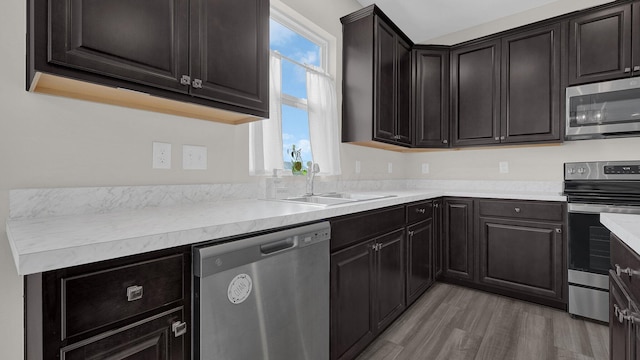 8145 Rhoderick Cir, Reynoldsburg, OH 43068 - kitchen featuring stainless steel appliances, light wood-type flooring, and light countertops