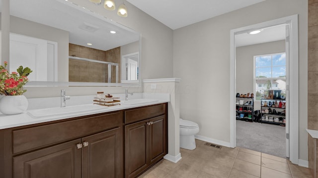 8145 Rhoderick Cir, Reynoldsburg, OH 43068 - full bath with double vanity, a stall shower, and tile patterned flooring