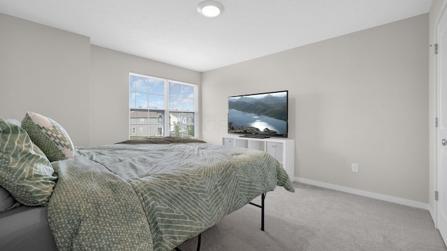 8145 Rhoderick Cir, Reynoldsburg, OH 43068 - bedroom featuring baseboards and light carpet