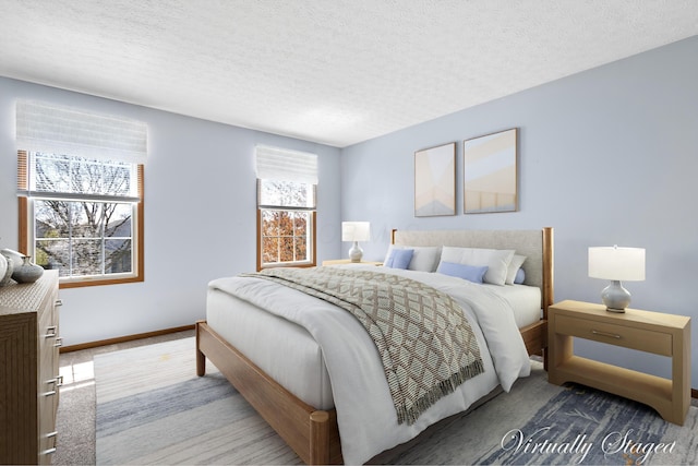 5722 Silver Spurs Ln, Galloway, OH 43119 - carpeted bedroom featuring a textured ceiling and baseboards
