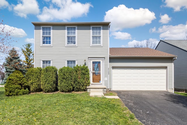 5722 Silver Spurs Ln, Galloway, OH 43119 - view of front of house with driveway, a garage, and a front lawn