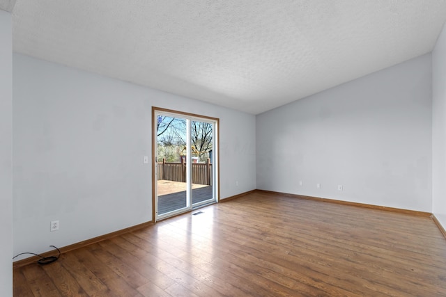 5722 Silver Spurs Ln, Galloway, OH 43119 - spare room with hardwood / wood-style floors and a textured ceiling