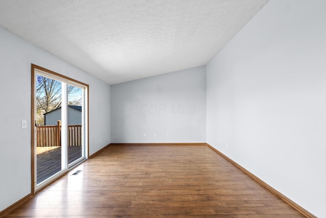 5722 Silver Spurs Ln, Galloway, OH 43119 - empty room featuring wood finished floors and a textured ceiling