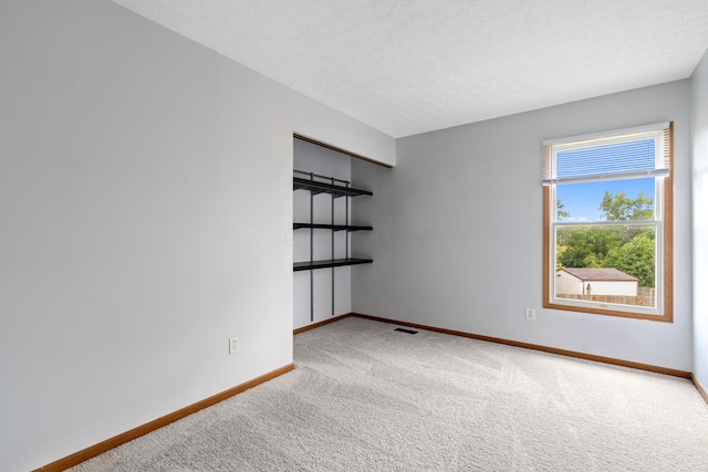 5722 Silver Spurs Ln, Galloway, OH 43119 - unfurnished room featuring carpet floors and a textured ceiling