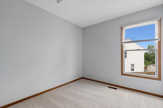 5722 Silver Spurs Ln, Galloway, OH 43119 - spare room featuring carpet and baseboards