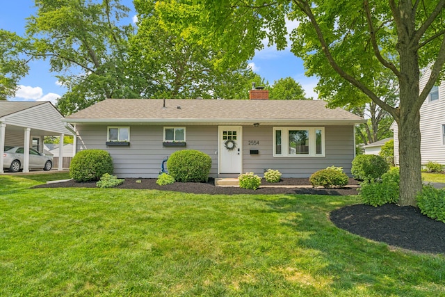 2554 Nottingham Rd, Upper Arlington, OH 43221 - view of front facade with a chimney, a front yard, and roof with shingles