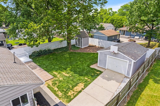 2554 Nottingham Rd, Upper Arlington, OH 43221 - fenced backyard featuring a storage shed, a garage, and driveway