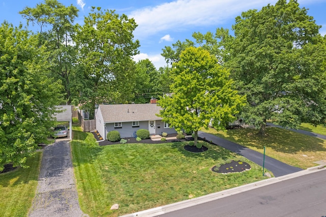 2554 Nottingham Rd, Upper Arlington, OH 43221 - view of front facade with a front lawn, a carport, and a chimney