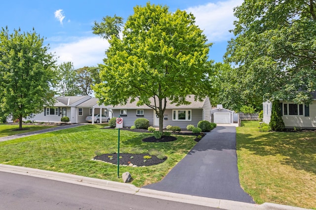 2554 Nottingham Rd, Upper Arlington, OH 43221 - view of front facade with an outbuilding, a front lawn, driveway, and a garage