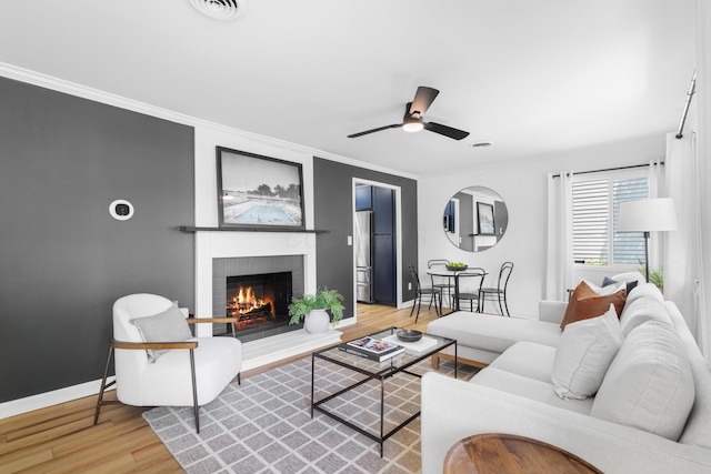 2554 Nottingham Rd, Upper Arlington, OH 43221 - living area with wood finished floors, a fireplace, ceiling fan, and ornamental molding