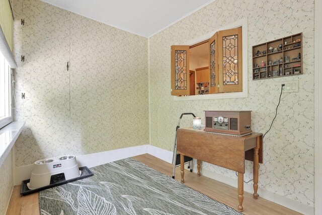 2083 Welsh Hills Rd, Granville, OH 43023 - bedroom featuring wood finished floors, wallpapered walls, crown molding, and vaulted ceiling