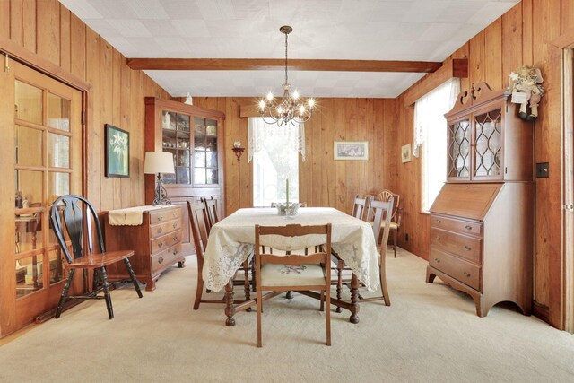 2083 Welsh Hills Rd, Granville, OH 43023 - dining area featuring wooden walls, plenty of natural light, beamed ceiling, a chandelier, and light colored carpet