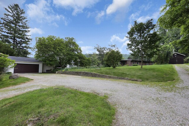 2083 Welsh Hills Rd, Granville, OH 43023 - view of front of home with driveway, a front yard, and an attached garage