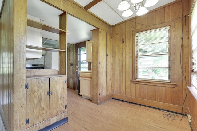 2083 Welsh Hills Rd, Granville, OH 43023 - kitchen featuring light wood-style floors, a chandelier, wood walls, range, and light countertops