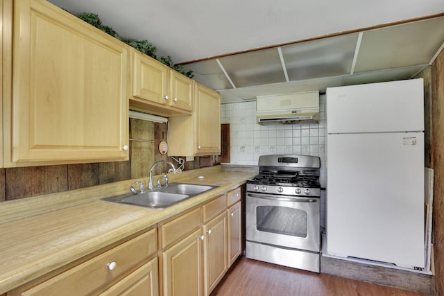 2083 Welsh Hills Rd, Granville, OH 43023 - kitchen with freestanding refrigerator, gas stove, ventilation hood, light brown cabinetry, and wood finished floors