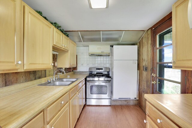 2083 Welsh Hills Rd, Granville, OH 43023 - kitchen featuring freestanding refrigerator, stainless steel range with gas stovetop, light wood-type flooring, light brown cabinets, and under cabinet range hood