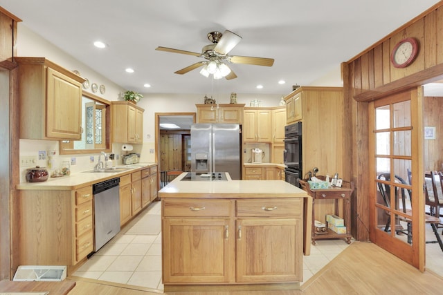 2083 Welsh Hills Rd, Granville, OH 43023 - kitchen with appliances with stainless steel finishes, an island with sink, light brown cabinetry, a ceiling fan, and plenty of natural light