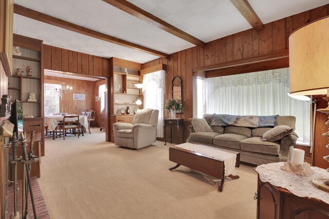 2083 Welsh Hills Rd, Granville, OH 43023 - living room with wooden walls, beamed ceiling, carpet floors, and a chandelier