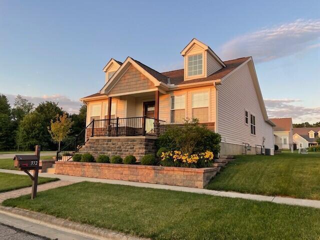 332 Bottecchia Blvd, Johnstown, OH 43031 - view of front of home with a front lawn, a porch, and stairs