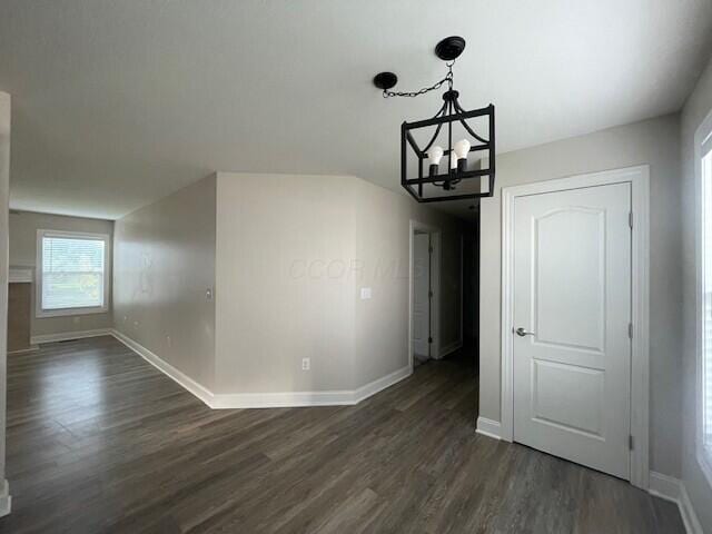 332 Bottecchia Blvd, Johnstown, OH 43031 - unfurnished dining area featuring dark wood finished floors and a chandelier